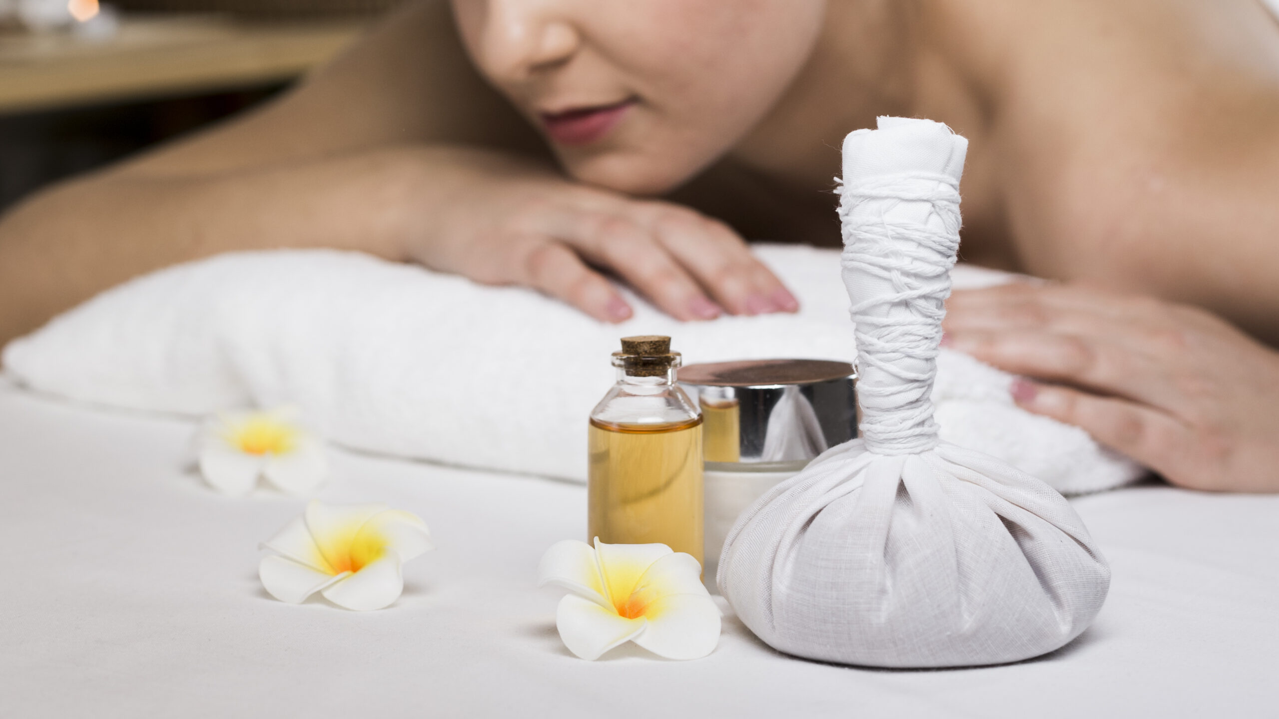 woman-receiving-massage-spa-center