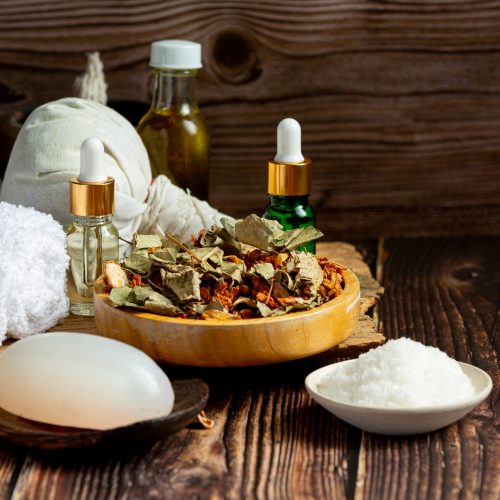 herbal spa treatment equipments put on wooden floor