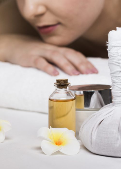 woman-receiving-massage-spa-center