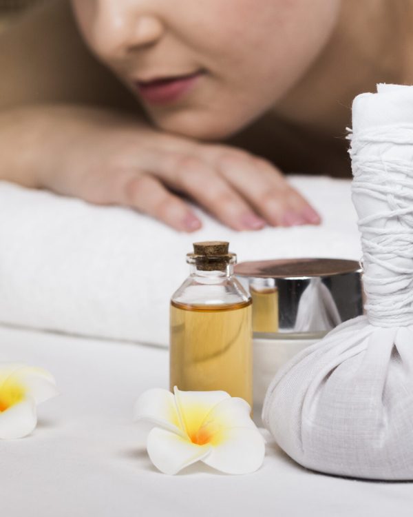 woman-receiving-massage-spa-center